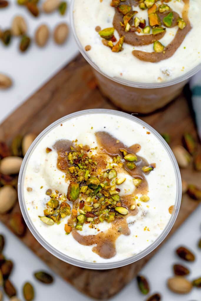 Top of Pistachio Cream Cold Brew with cold foam, brown butter cookie topping, and crushed pistachios.