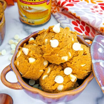 Overhead closeup view of pumpkin cookie dough with white chocolate chips.