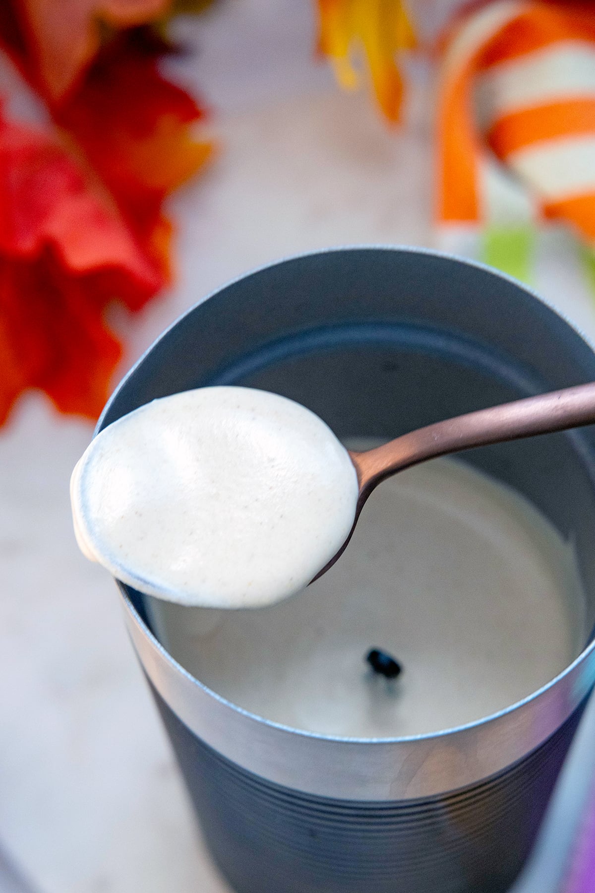 Pumpkin cold foam on spoon.