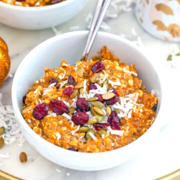 Closeup view of pumpkin muesli with dried fruit, shredded coconut and pumpkin seeds.