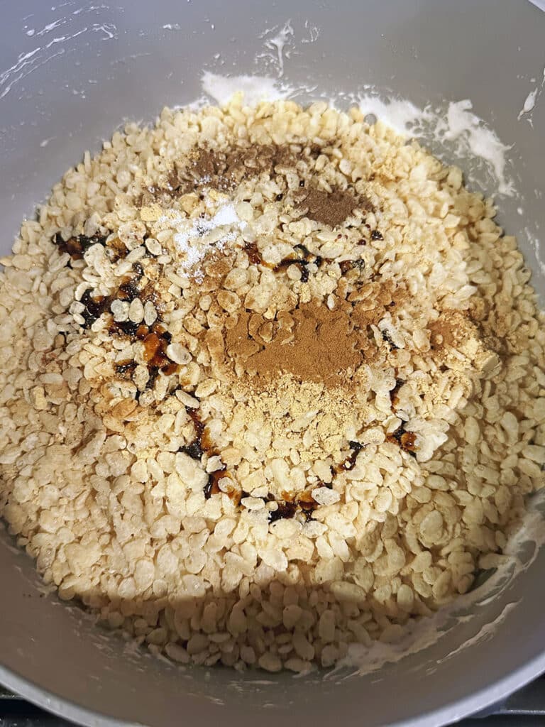 Rice Krispies in saucepan with molasses and spices.