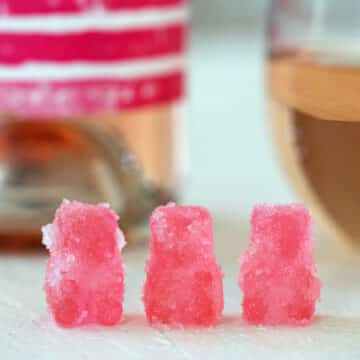 Closeup view of pink rosè sour patch bears.