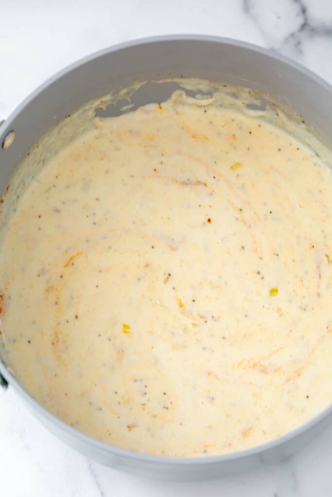 Cheese sauce in pot.