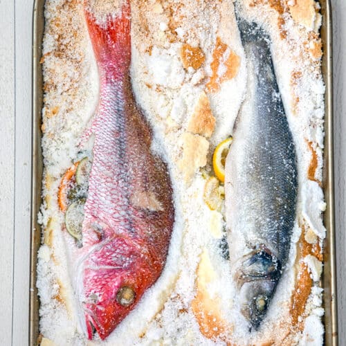 Two whole fish baked in salt.