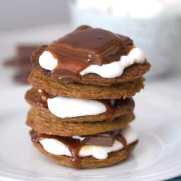 Closeup view of a stack of salted caramel cookie s'mores.