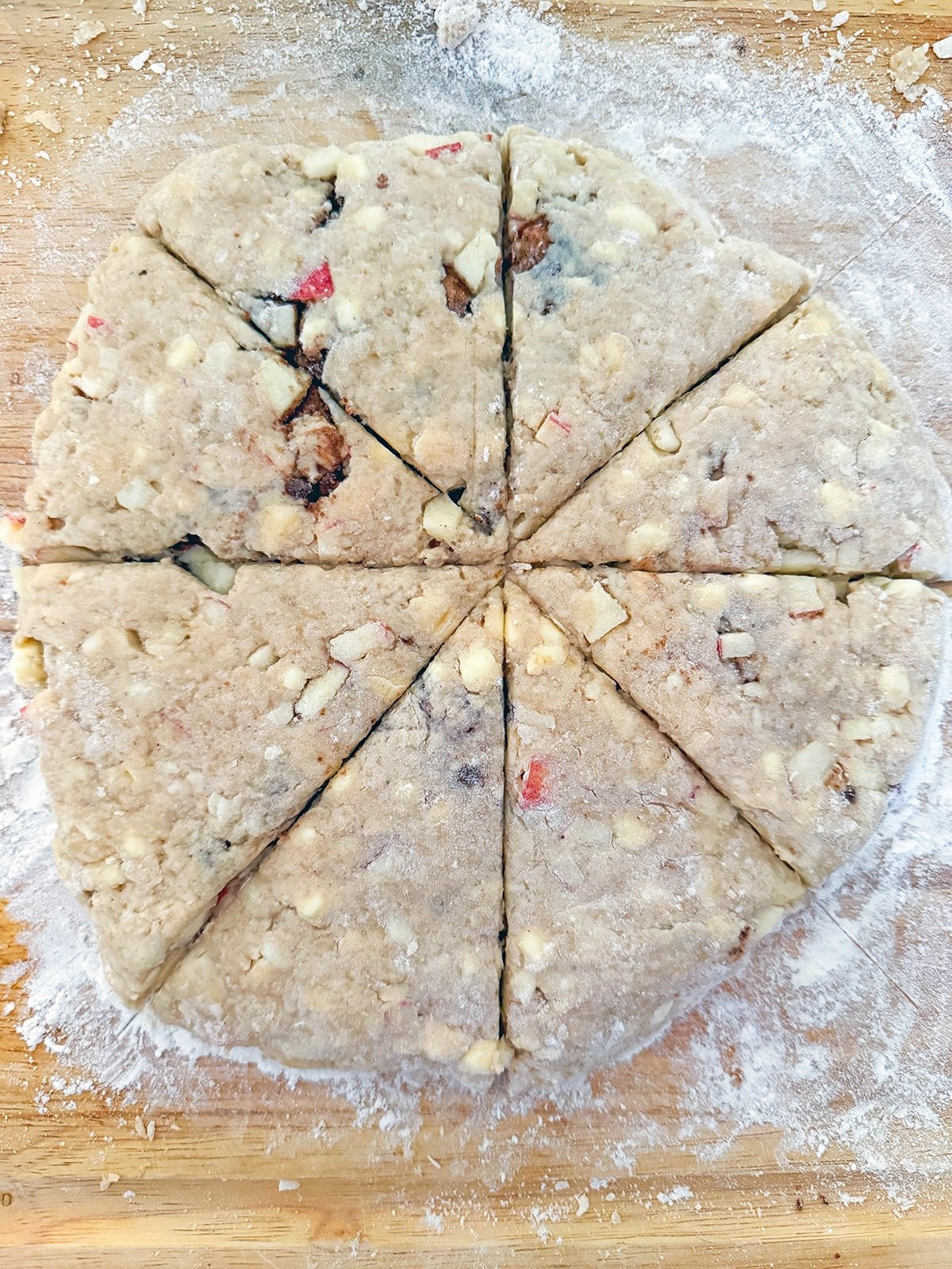 Scone dough rolled into round and sliced into 8 wedges.