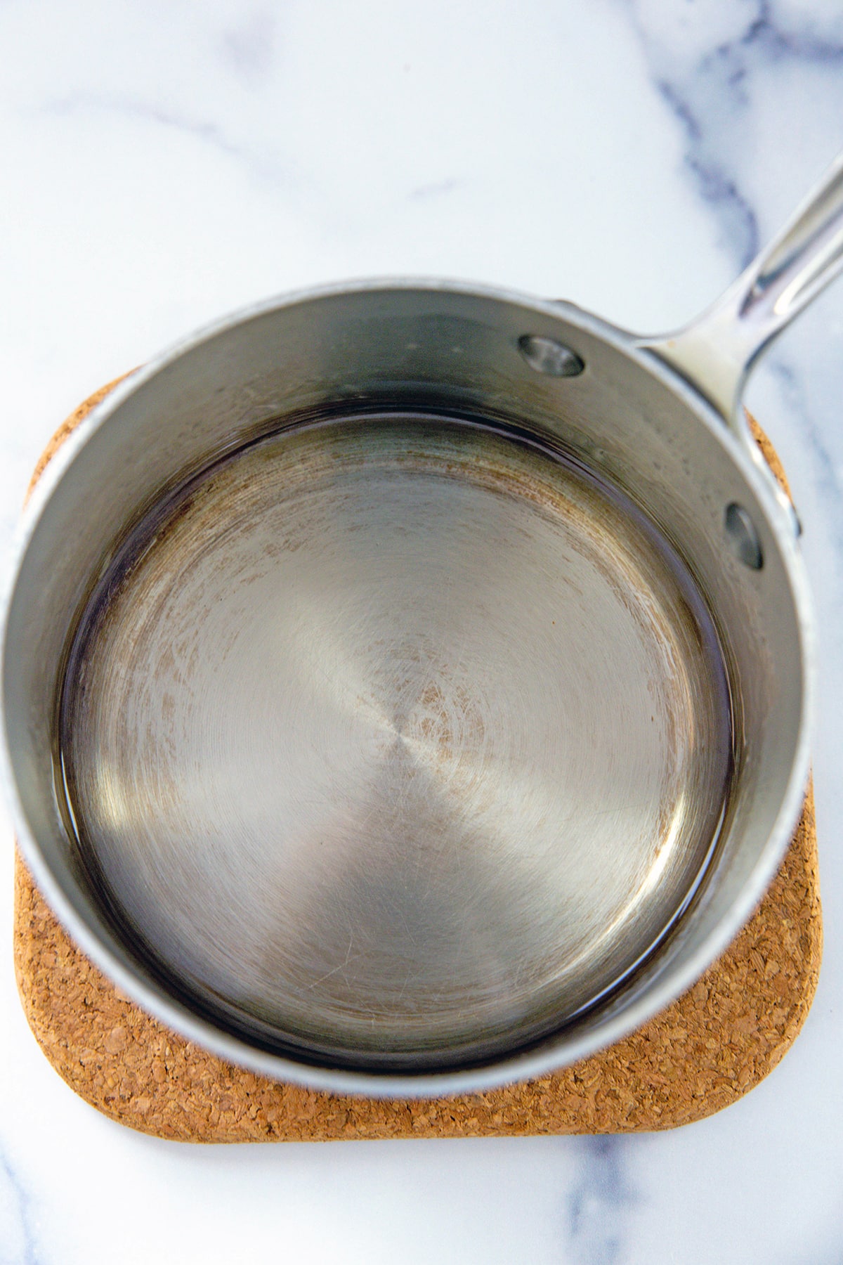 Simple syrup in saucepan.
