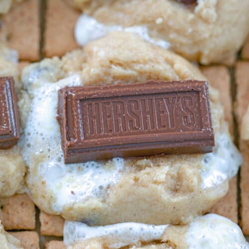Closeup view of a s'mores cookie bar with Hershey's bar on top.