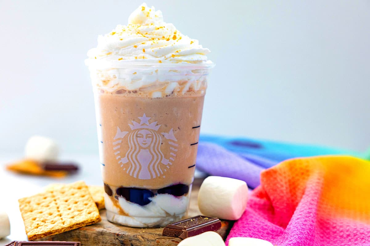 Head-on landscape view of a S'mores Frappuccino wtih whipped cream.