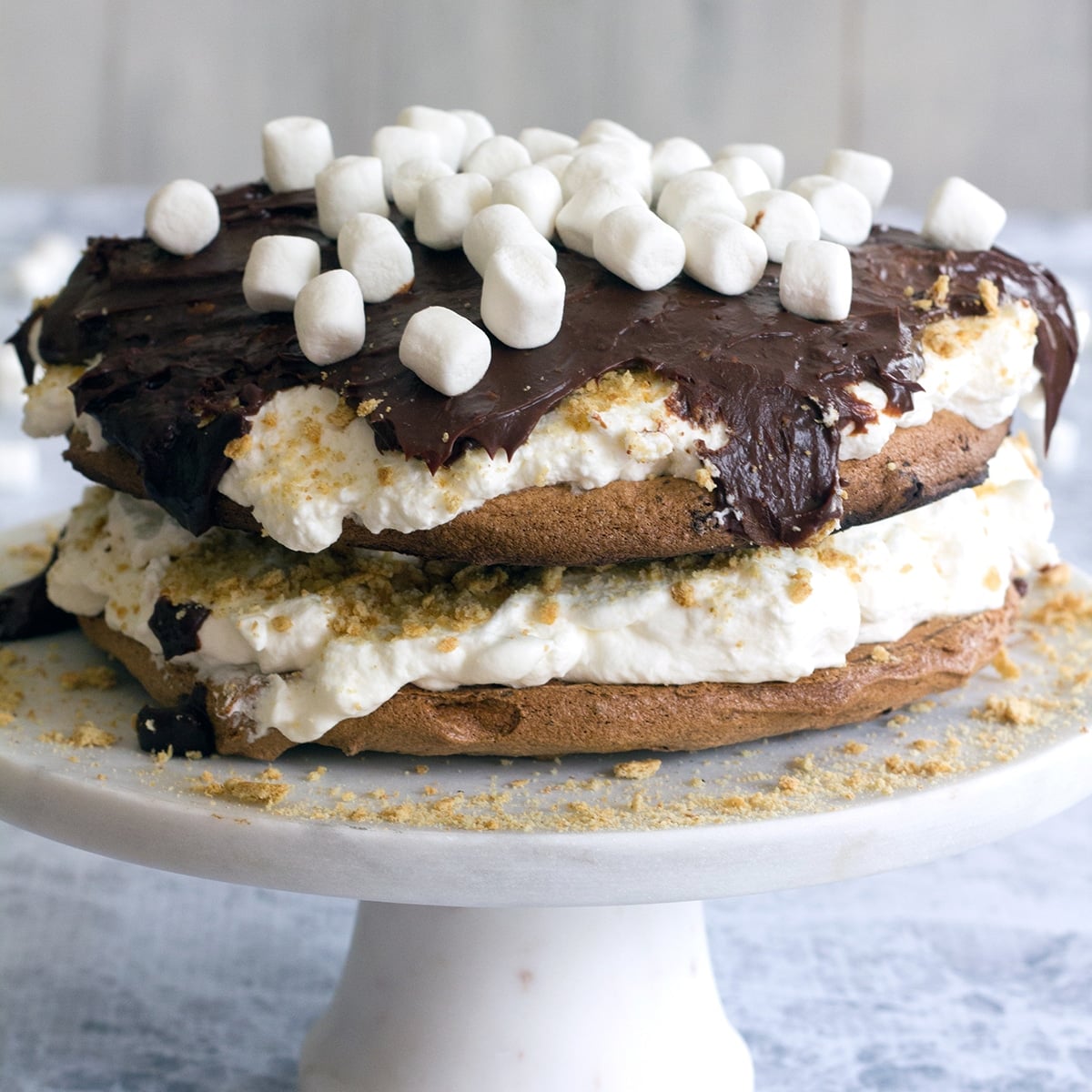 Closeup of s'mores pavlova on a cake stand.