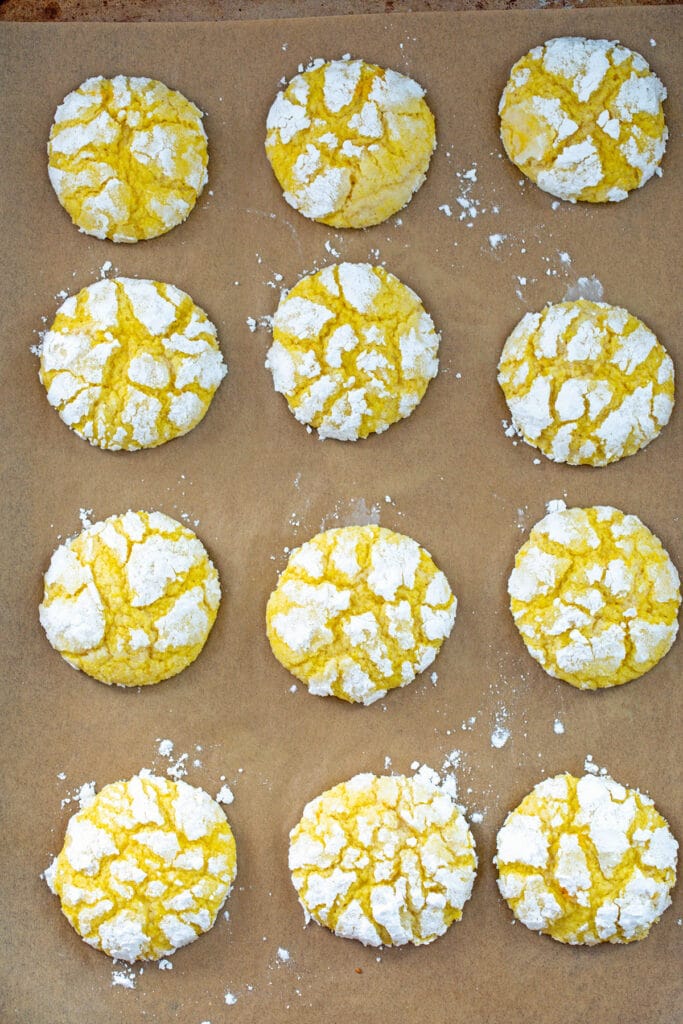 Soft lemon cookies just out of the oven on baking sheet.