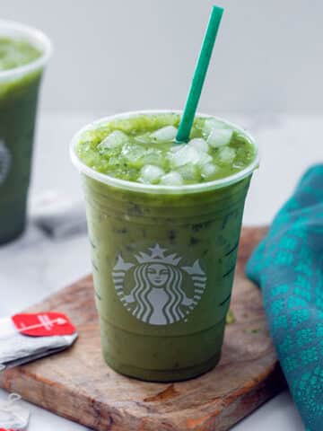Overhead view of two Starbucks Green Drinks with tea bags all around.