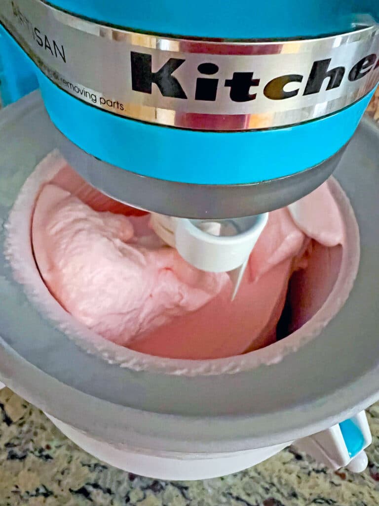 Pink Starburst ice cream processing in KitchenAid ice cream maker.