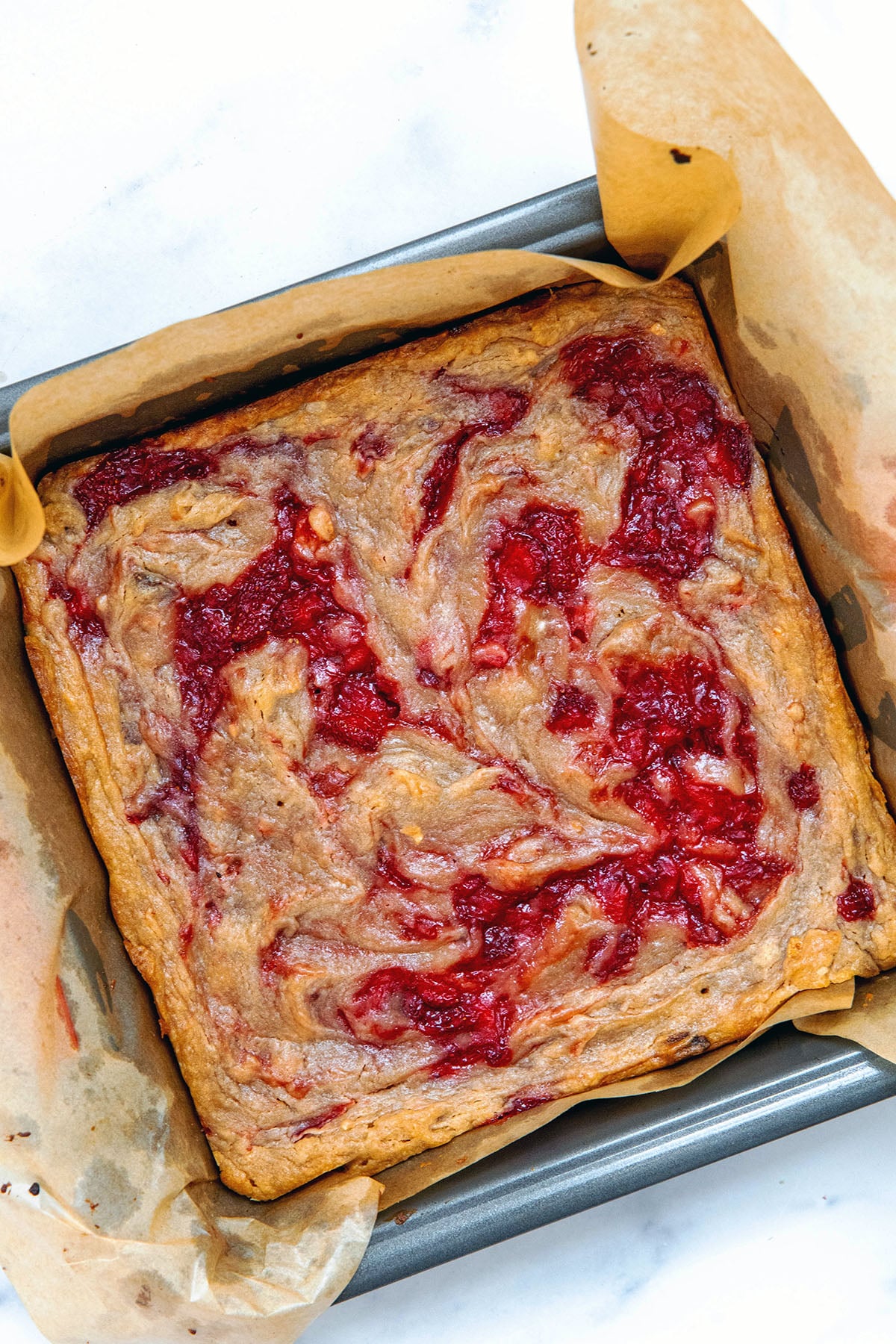 Strawberry brownies in pan just baked.