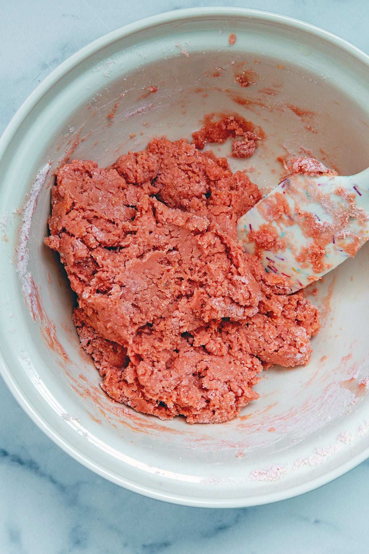 Strawberry cake mix cookie batter in bowl.