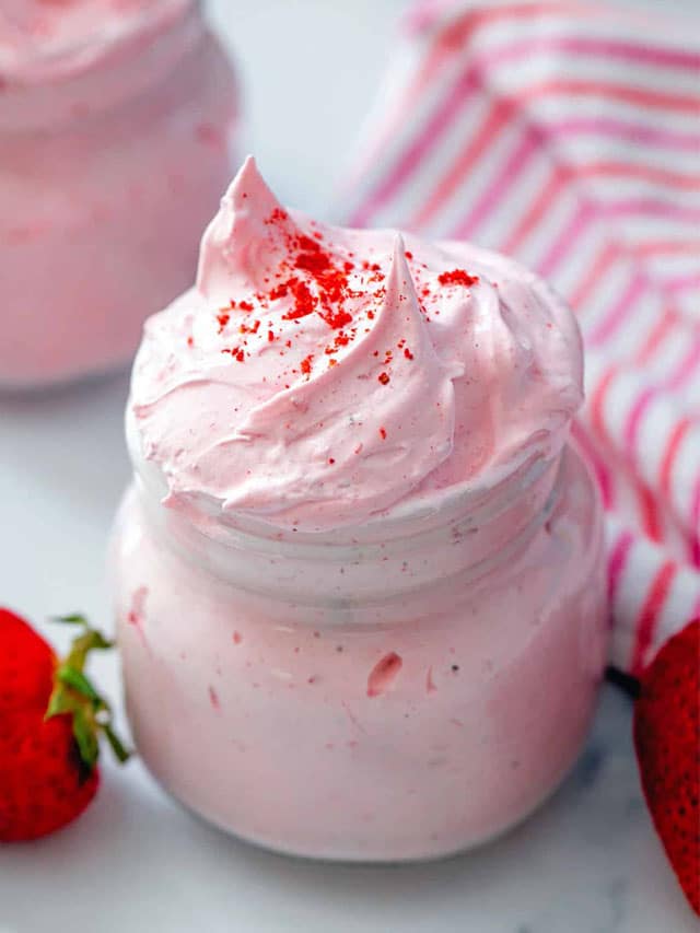 Small mason jar filled with strawberry fluff.