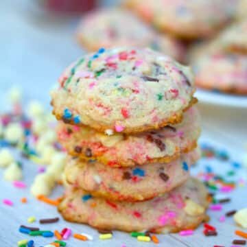 Closeup view of rainbow sprinkles strawberry milk cookies.
