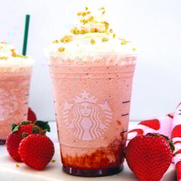 Closeup view of a Strawberry Shortcake Frappuccino in a Starbucks cup.
