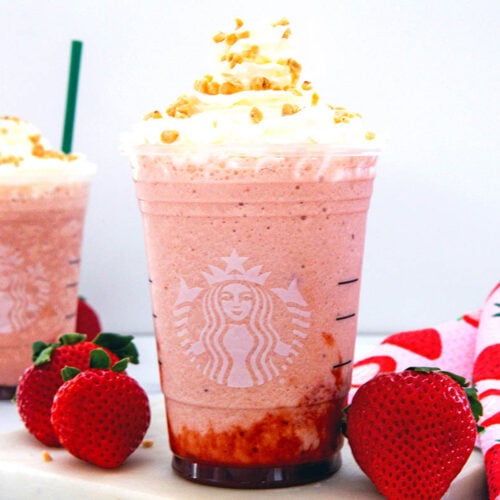 Closeup view of a Strawberry Shortcake Frappuccino in a Starbucks cup.