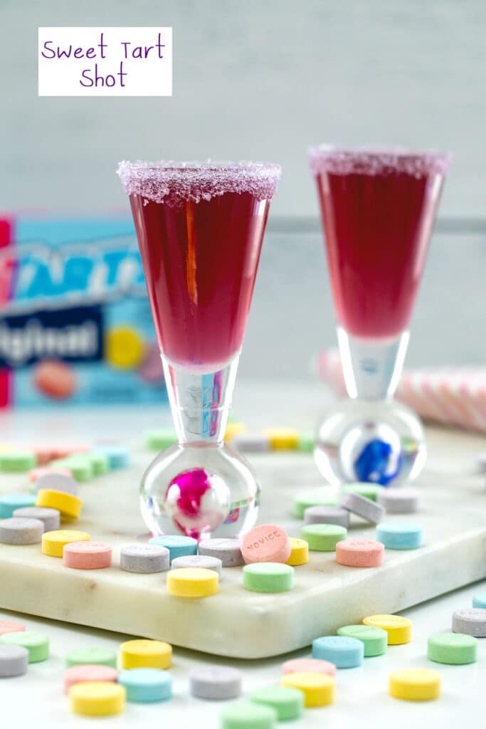 Purple Sweet Tart shot with Sweet Tart candies all around, box in background, and recipe title at top.