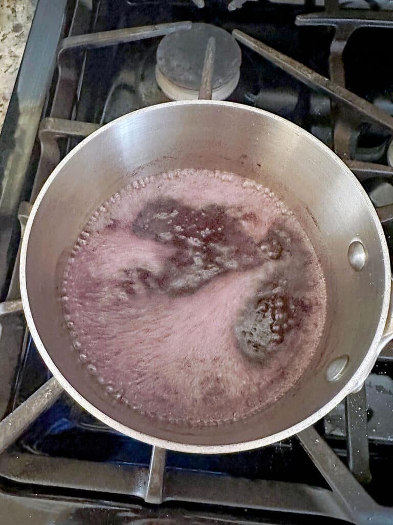 Sweet Tart syrup boiling in saucepan.