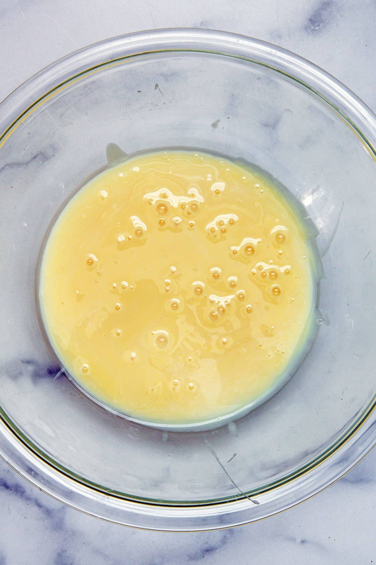 Sweetened condensed milk in bowl.