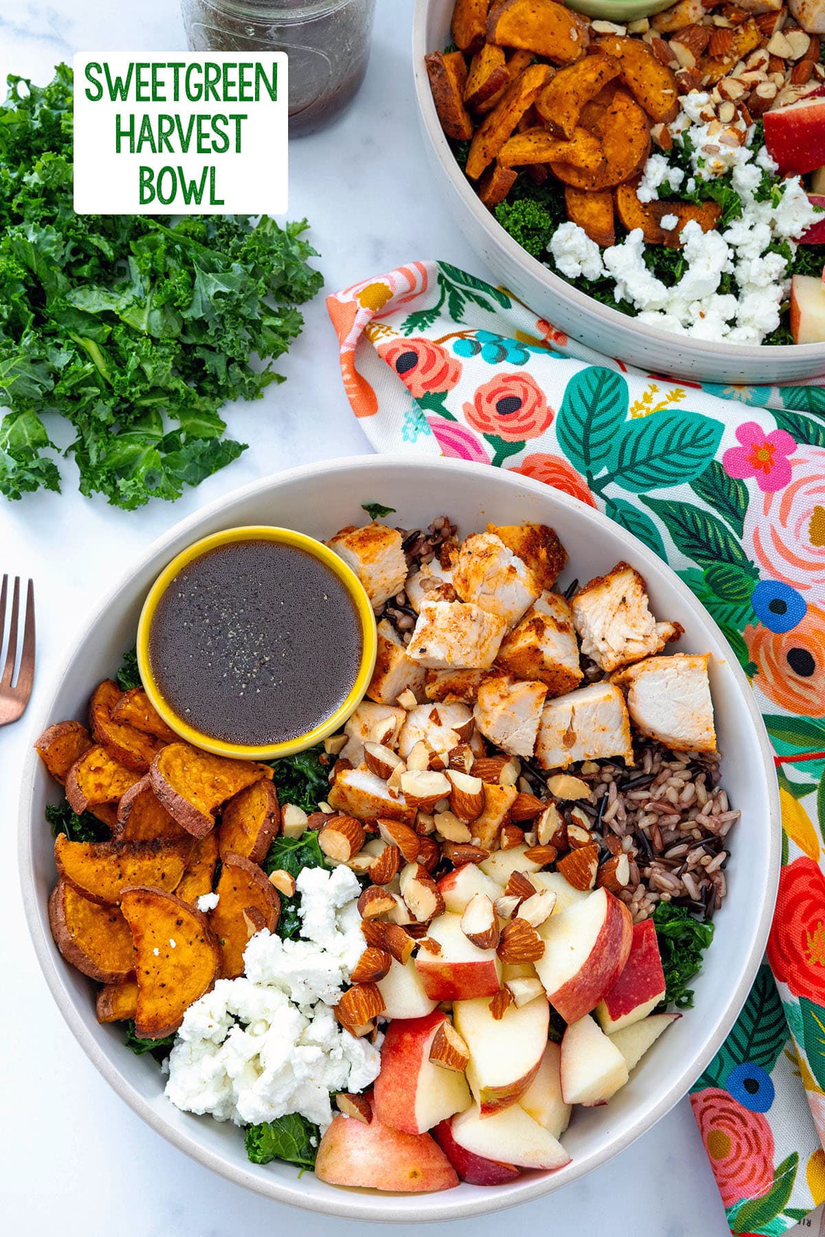 Overhead view of a Sweetgreen Harvest Bowl with kale, sweet potato, apples, chicken, rice, and dressing with recipe title at the top.