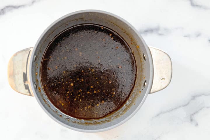 Overhead view of toffee nut syrup in a saucepan.