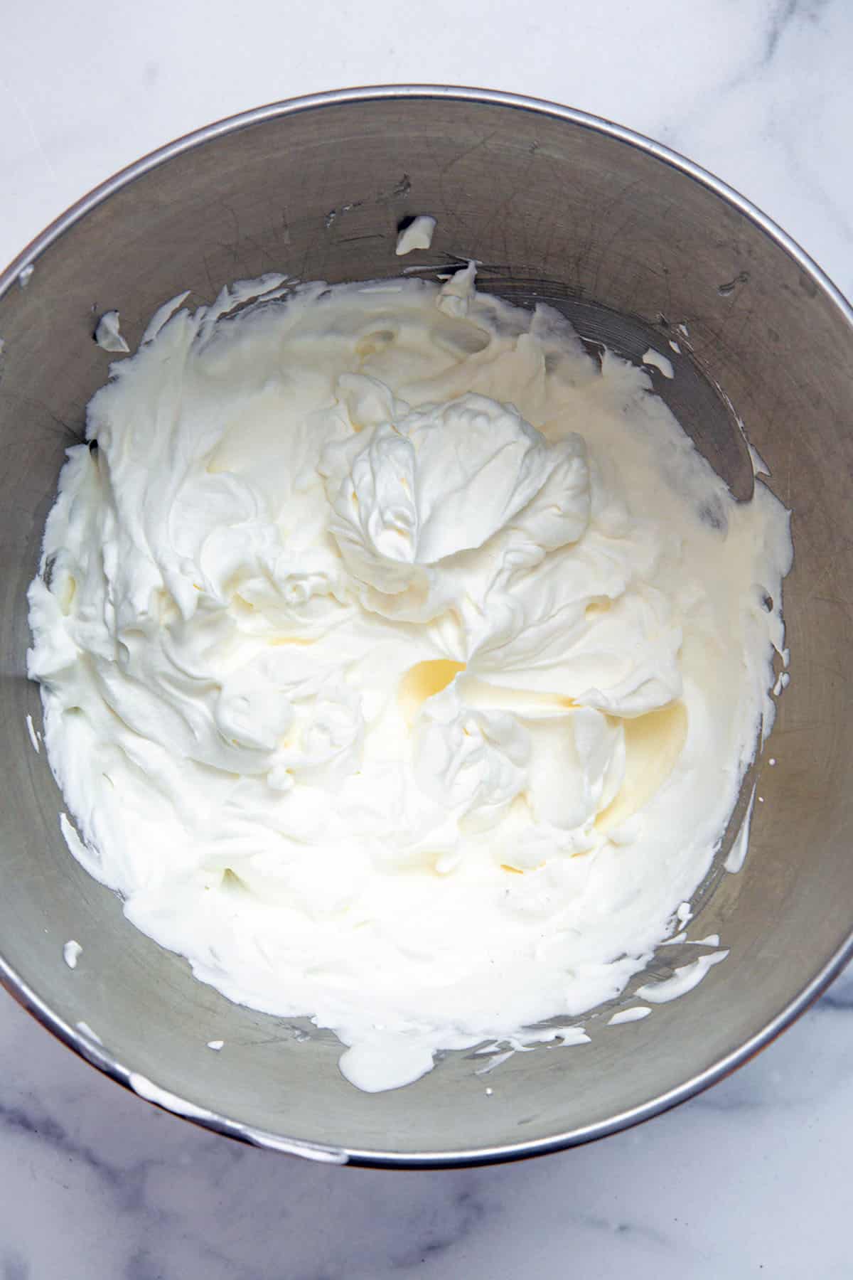 Whipped cream in mixing bowl.