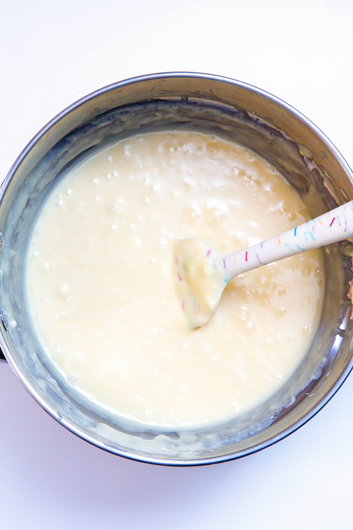Overhead view of pot with melted white chocolate.